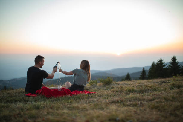 Couple spending celebratory vacation together on a mountain top