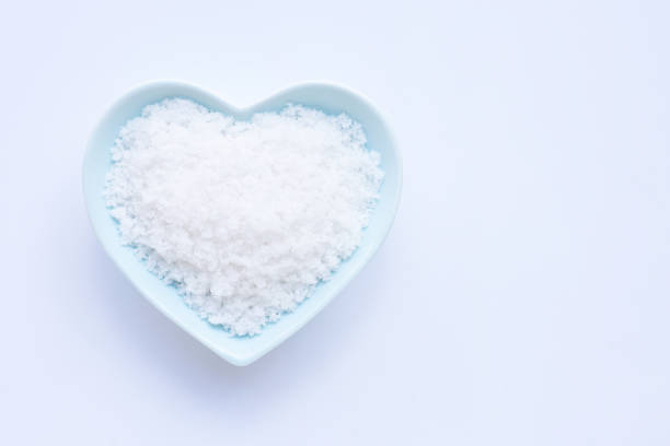 istock Salt in heart shape ceramic bowl on white background. 1183836585