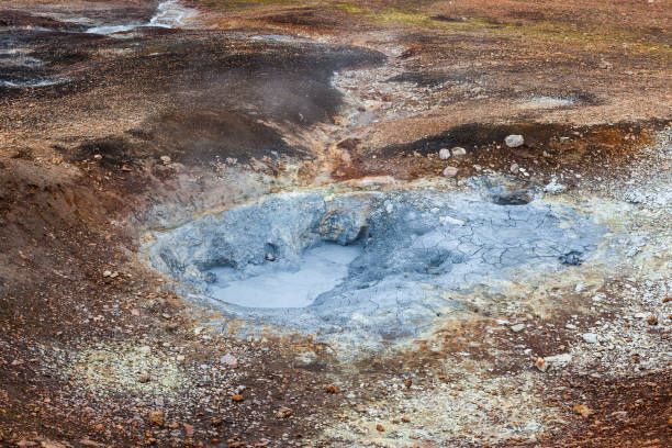 istock Grey hot mud bubbling in a hole at the geothermal active area on Laugavegur trail to Landmannalaugar in Iceland. 1183838326