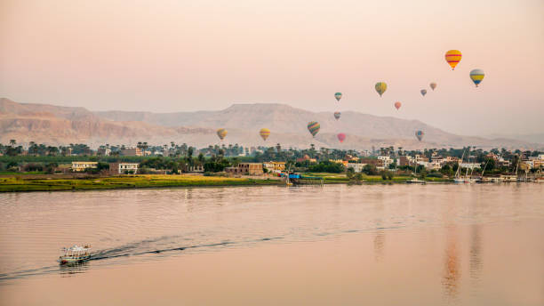 Hot air balloon in Luxor at sunrise Hot air balloons Over the nile river in Luxor luxor thebes photos stock pictures, royalty-free photos & images