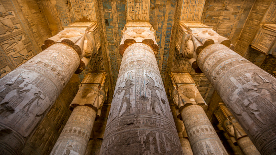 Qena, Egypt - December 27 2023: Columns of the Hypostyle Hall in Temple of Hathor in Dendera Temple complex, one of the best-preserved temple