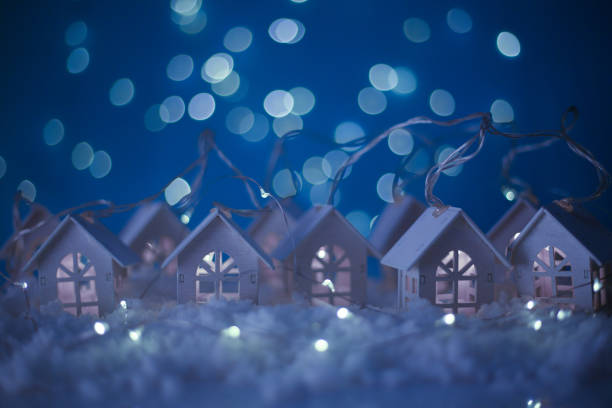 istock Glowing houses Christmas card 1183839453