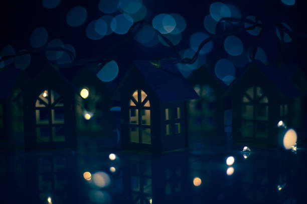 istock Glowing houses Christmas card 1183839461