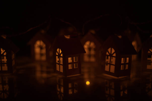 istock Glowing houses Christmas card 1183839471