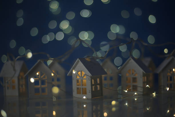 istock Glowing houses Christmas card 1183839474