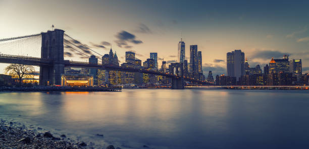 istock Brooklyn bridge East river and Manhattan at dusk 1183840147