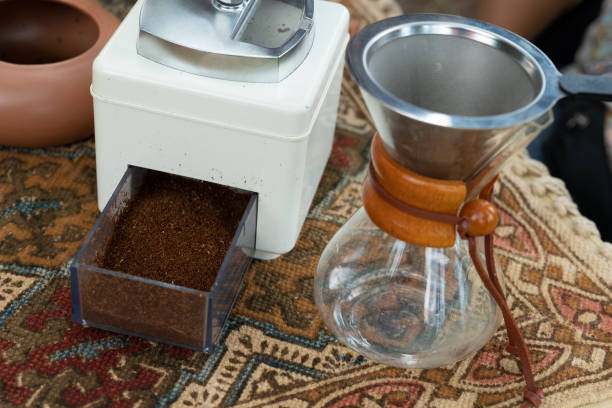 Fresh coffee beans in a silver grinder