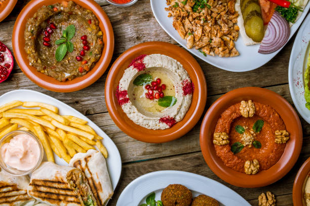 istock assorted Turkish dishes, hummus, muhamara, mutabal, falafel, shawarma 1183844838