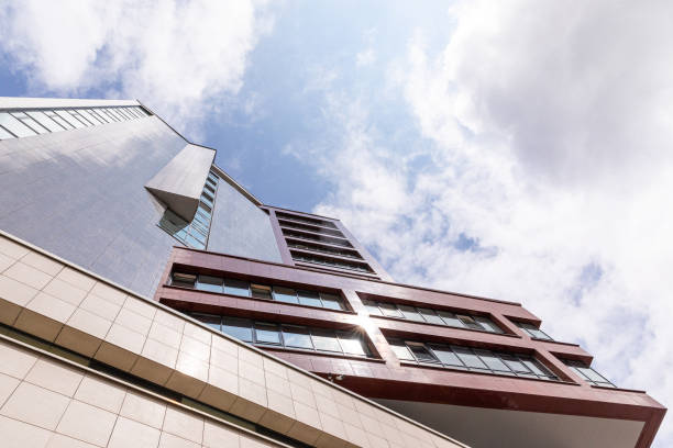 istock Bottom view of cutting-edge apartment building with geometry design facade. 1183845986