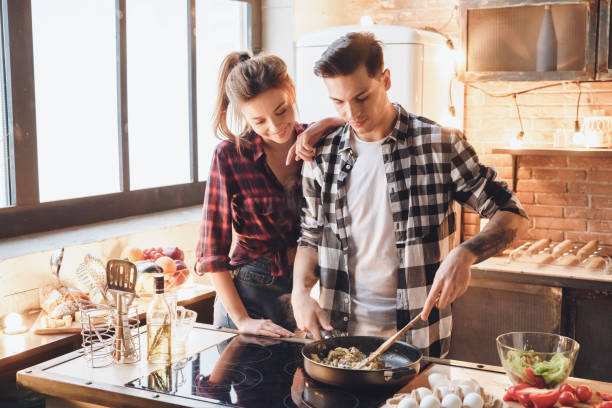 istock Handsome man prepares breakfast for his wife in bed 1183846141