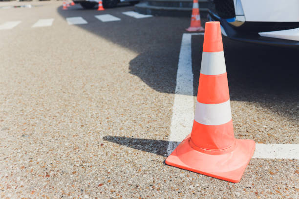 istock Barrier. Passage is closed. Driveway closed. Entry is prohibited. Protected and restricted area, limits. Red and white striped concrete road barriers lying on the asphalt pavement. 1183846356