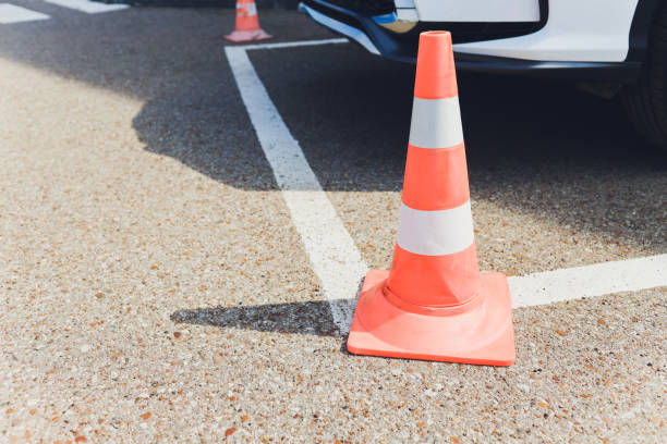 istock Barrier. Passage is closed. Driveway closed. Entry is prohibited. Protected and restricted area, limits. Red and white striped concrete road barriers lying on the asphalt pavement. 1183846357