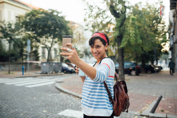 istock Cute young woman taking a selfie 1183846943