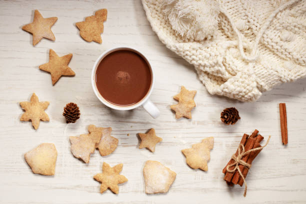 istock Hot chocolate in white cup with star shaped cookies 1183849852