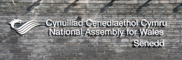 The sign at the building of the National Assembly for Wales / Cynulliad Cenedlaethol Cymru in Cardiff Bay, Cardiff, Wales, UK. The sign at the building of the National Assembly for Wales / Cynulliad Cenedlaethol Cymru in Cardiff Bay, Cardiff, Wales, UK. national assembly for wales stock pictures, royalty-free photos & images