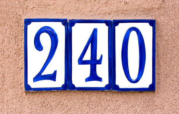 Blue and White Ceramic Number 240 Street Address Tile Blue and White Ceramic Number 240 Street Address Tile. Shot in Santa Fe, NM ceramic tile house numbers stock pictures, royalty-free photos & images