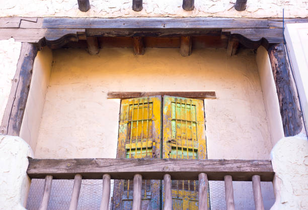 Santa Fe, NM: Old wooden door on antique adobe balcony. Shot at Santa Fe Village, a small shopping mall in downtown Santa fe.