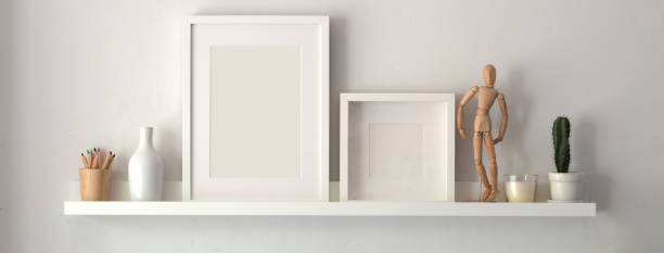 Mock up frame and decorations on shelf with white wall