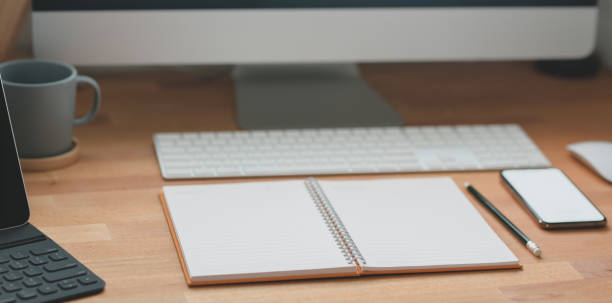 istock Cropped shot of modern workspace with office supplies and desktop computer 1183865055