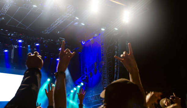 istock Concert arena with fans clapping 1183865753
