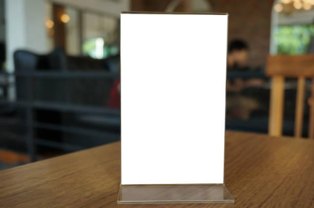 istock Menu frame standing on wood table in Bar restaurant cafe. space for text marketing promotion. 1183871324