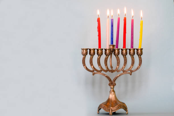 Sixth day of Hanukkah with burning Hanukkah colorful candles in Menorah.Chanukkah-jewish holiday. Sixth day of Hanukkah with burning Hanukkah colorful candles in Menorah traditional Candelabra .Chanukkah-jewish holiday. Each night, another candle is added. Copy space for text. day 6 stock pictures, royalty-free photos & images