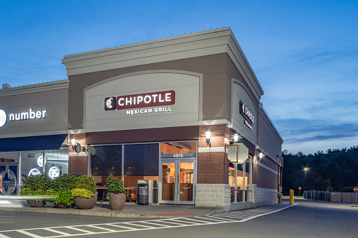 New Hartford, New York - Aug 18, 2019: Night View of Chipotle Mexican Grill Restaurant, Chipotle is an American Fast Food Brand Specialized in Grill & Mexican Food.