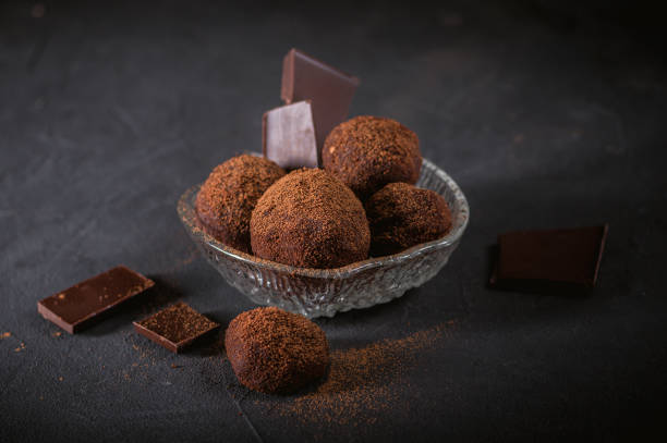 istock Chocolate truffle candy with cocoa powder 1183885755