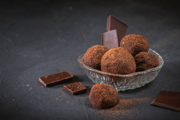 istock Chocolate truffle candy with cocoa powder 1183885757
