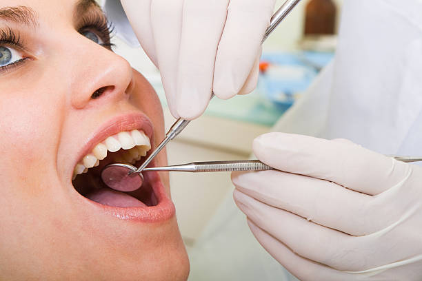 istock Young woman has teeth inspected by dentist 118388669