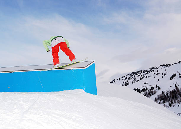 istock young snowboarder woman jibbing 118388740