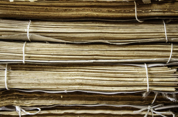 istock Old damaged newspapers 1183887968