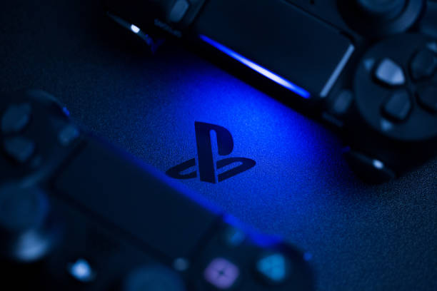 Russia, OKTOBER 24 2019: PS4 console background. Playstation 4 controllers. Sony gaming console Russia, OKTOBER 24 2019: PS4 console background. Playstation 4 controllers. Sony gaming console gamepad photos stock pictures, royalty-free photos & images