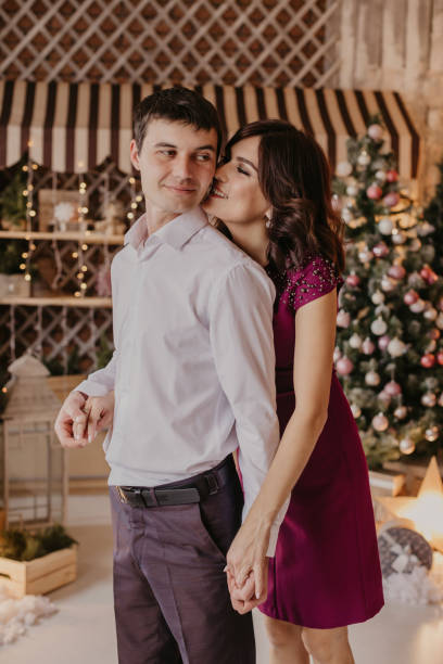 istock Happy couple celebrating Christmas together - Image 1183891115