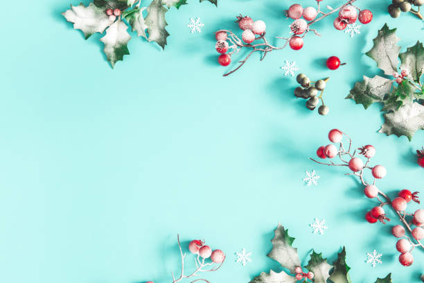 istock Christmas composition. Frame made of christmas plants on blue background. Flat lay, top view, copy space 1183892984