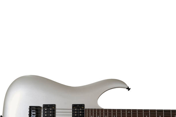 istock Closeup of white electric six string guitar black pickups and control knobs isolated on white background. Isolated on white background 1183893058