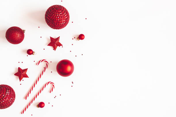 Christmas composition. Red decorations on white background. Christmas, winter, new year concept. Flat lay, top view, copy space