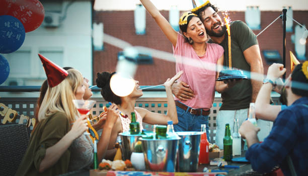 istock Rooftop birthday party. 1183893928