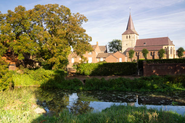 View over the Uffelse brook at Grathem church in the Dutch province Limburg
