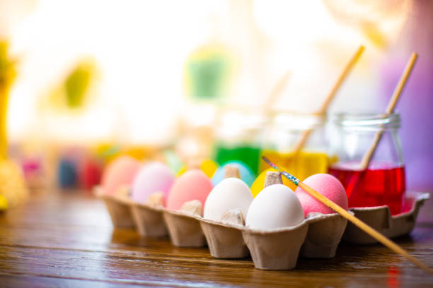 istock Happy Easter. Background with colorful eggs in basket. Table decorating for holiday. Top view 1183896340