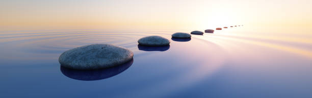 Pebbles in wide calm Ocean Row of stones in calm water in the wide ocean concept of meditation - 3D illustration spiritual enlightenment stock pictures, royalty-free photos & images