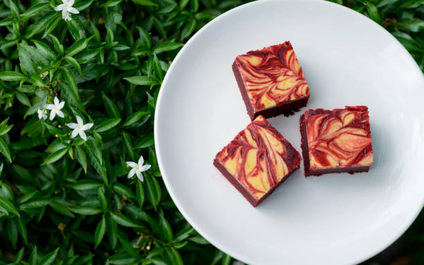 istock Red velvet cream cheese brownies on white dish 1183897961
