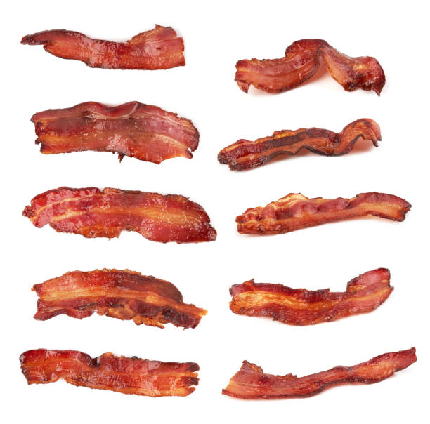 bacon on white Fried bacon isolated on a white background uncooked bacon stock pictures, royalty-free photos & images