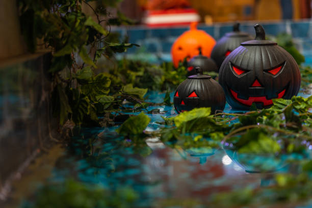 istock Group of spooky black and orange jack o lantern 1183901001