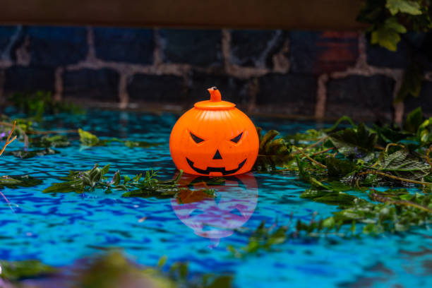 istock Halloween ornament jack o lantern pumpkin head with creepy background 1183901241