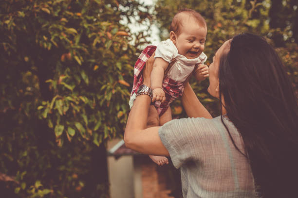 istock Baby enjoying in mom's arms 1183901720