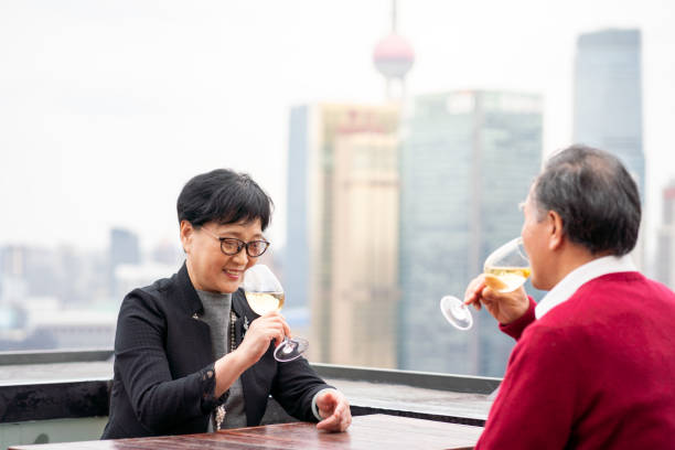 istock Affluent senior couple enjoying wine at a rooftop bar 1183904588
