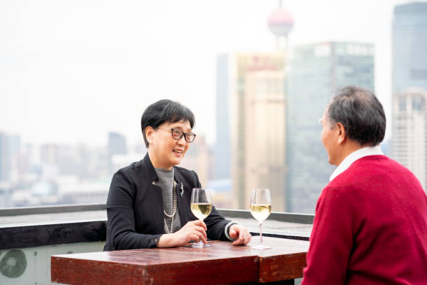 istock Affluent senior couple enjoying wine at a rooftop bar 1183904589