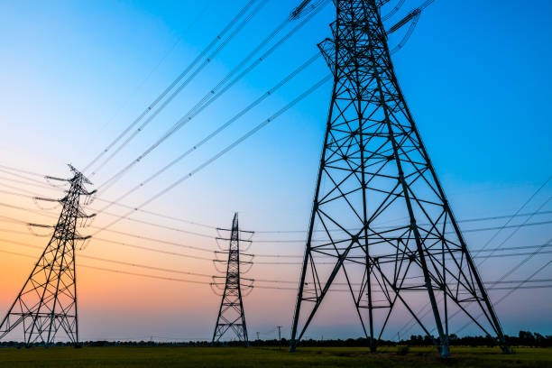 istock High voltage tower silhouette and sky landscape at dusk 1183904663