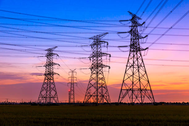 istock High voltage tower silhouette and sky landscape at dusk 1183904666